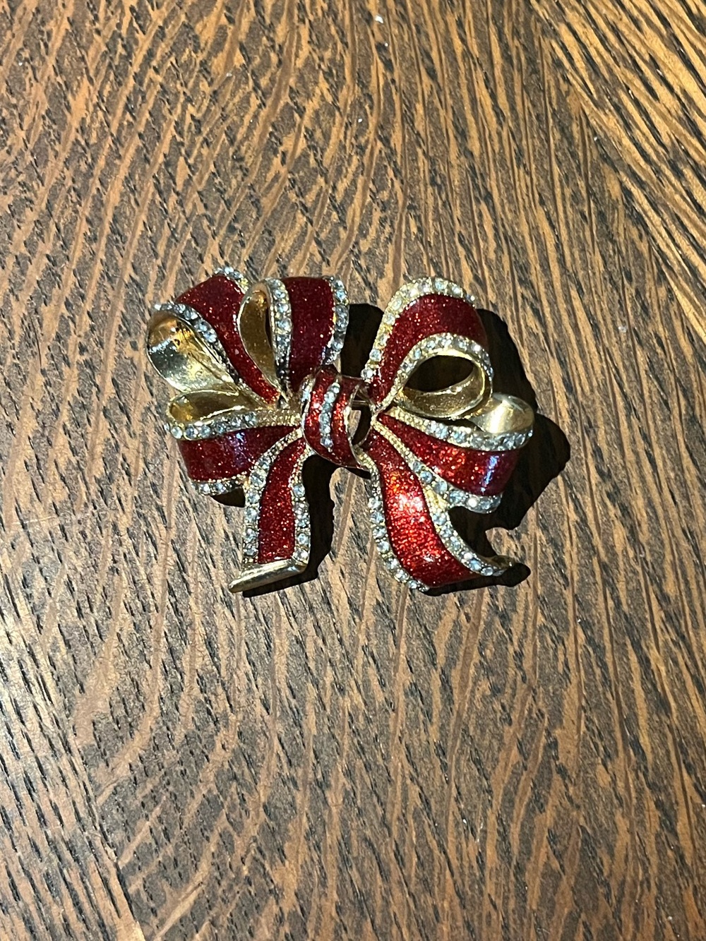 Gold-Tone Red Enamel Bow Brooch with Crystal Accents